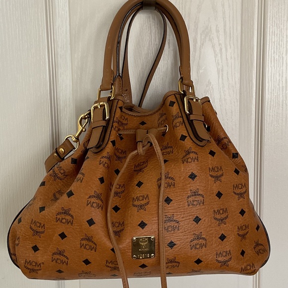 MCM Handbags - MCM Cognac Visetos Drawstring Shoulder Bag with Gold Hardware